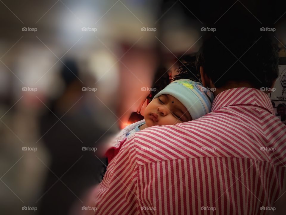 Strong shoulders. Baby sleeping on her dad's shoulder