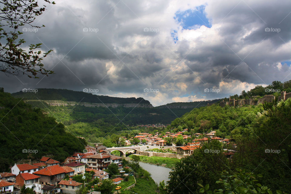 Landscape of town, mountain and clouds