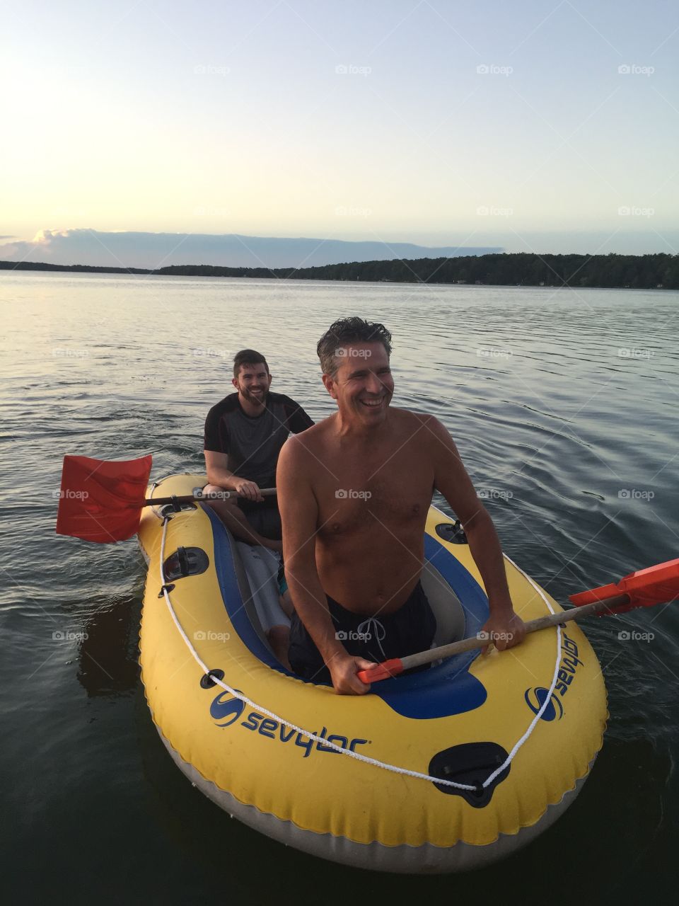 Male friends enjoying kayaking