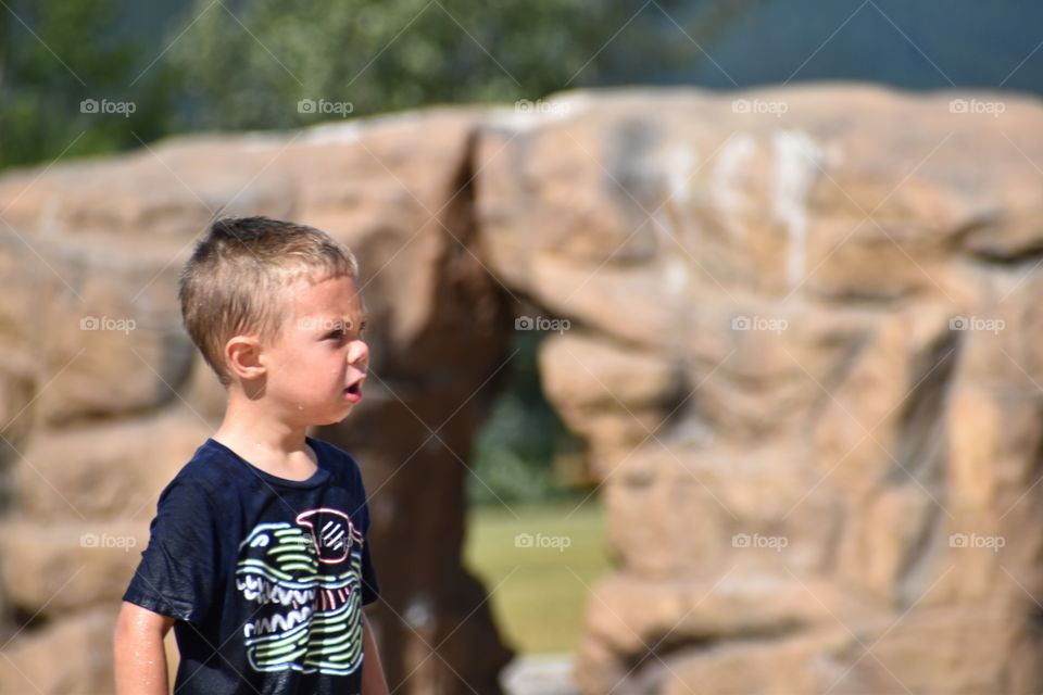 Boy at the splash park 