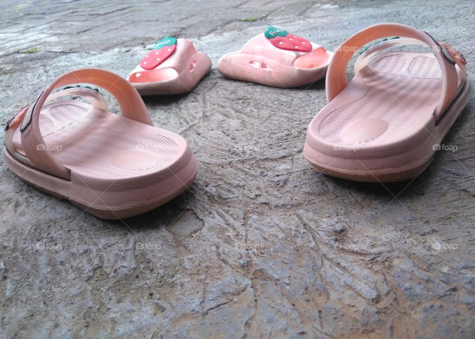 Children and women slippers on the yard