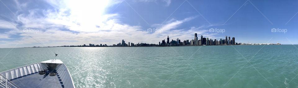 Chicago skyline divide: bright blue sky above Lake Michigan’s seafoam green.