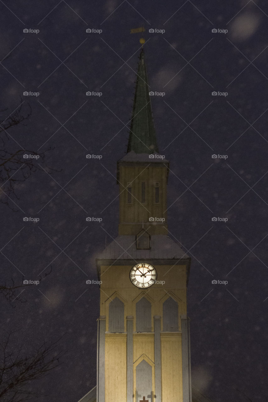 Church tower in the snow storm. Tromsø, Norway