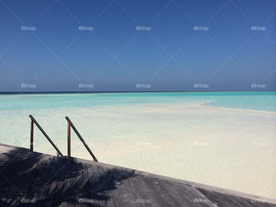 The climb down into tropical waters. 