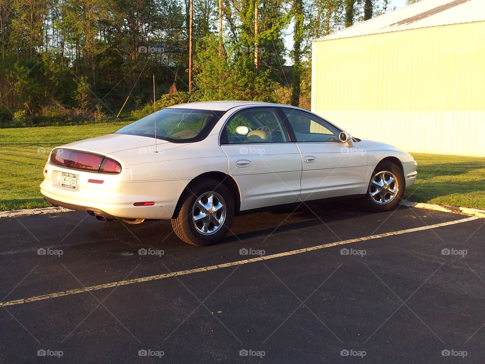 1998 Oldsmobile Aurora with chrome wheels again 
Credit: Greg Nilsen of Cross Court Tennis Club Wappingers Falls, NY
