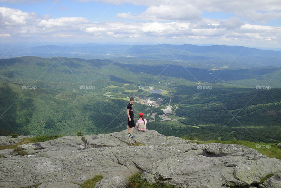 Outdoor adventures with my family make me happy. My two youngest sons relax and enjoy the view after our climb to the highest point in Vermont.