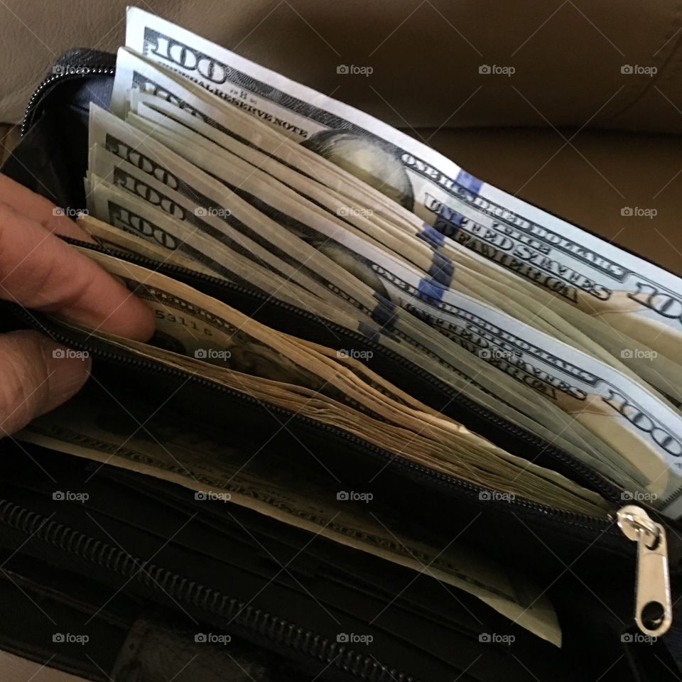 Wallet with savings U.S. cash.