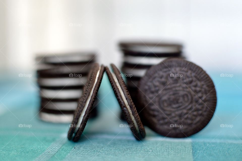 Oreo cookie thins on a white and light blue background 