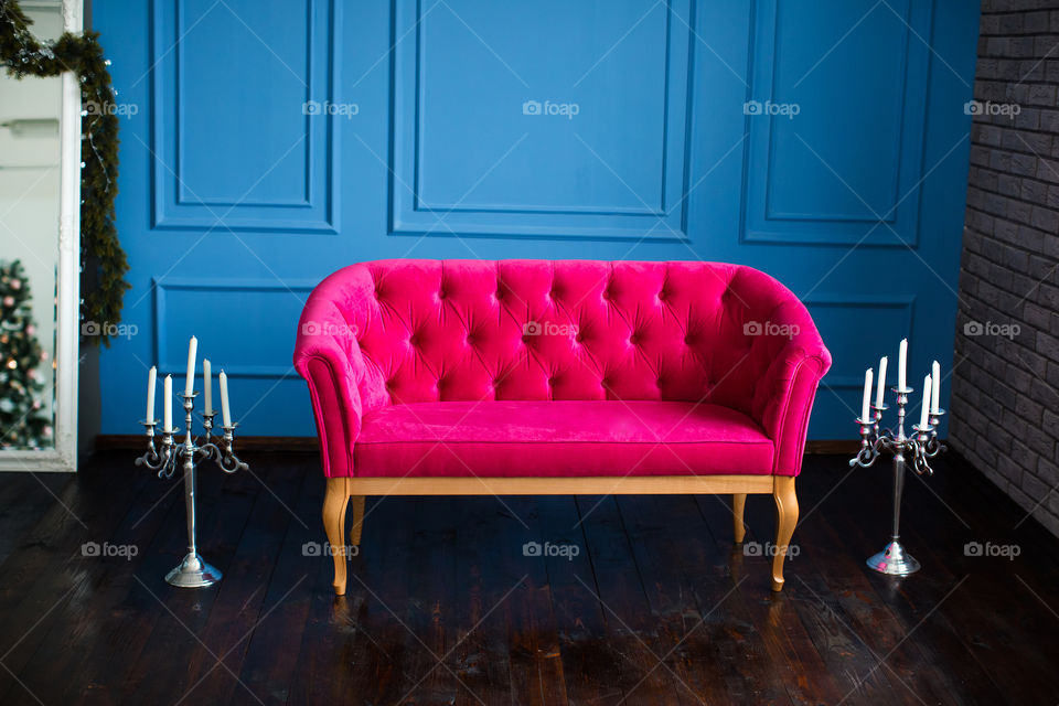 Pink sofa on floor