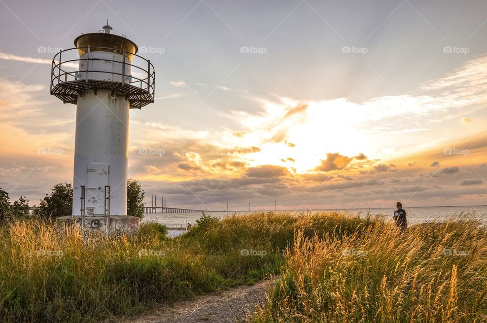 Distant view of a person near lighthouse