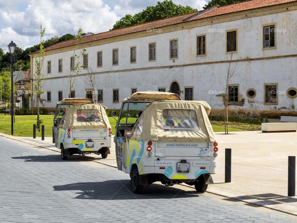 Tuk-Tuks on the road in Tomar, Portugal 