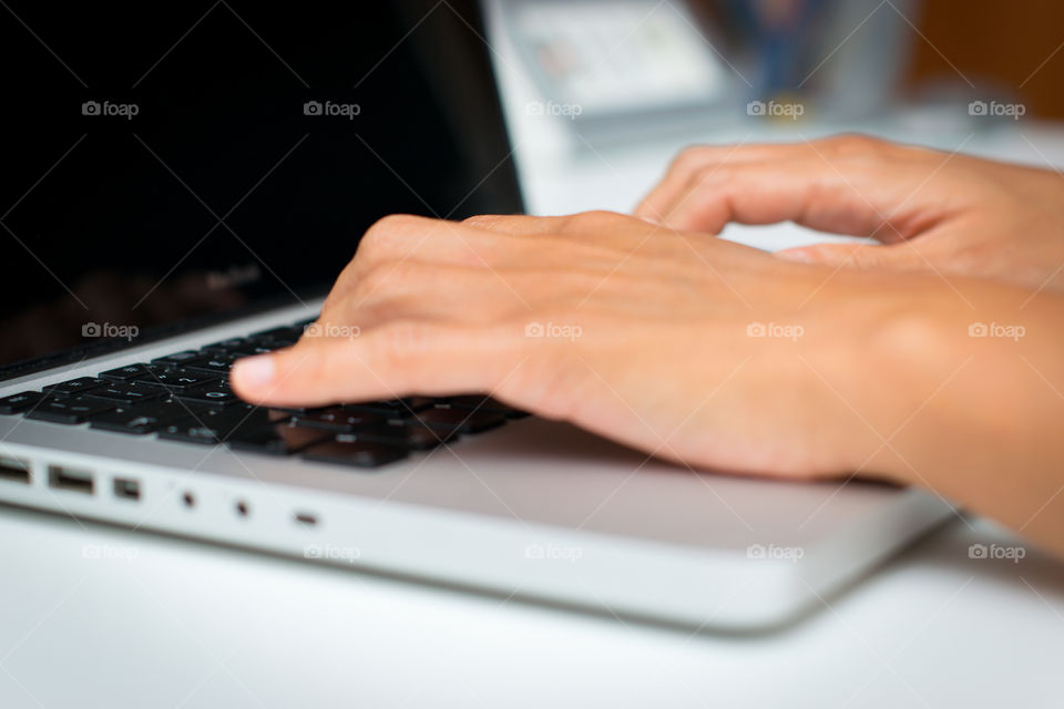 Woman while she is working at the computer