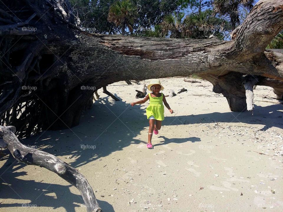 Girl Running on Beach