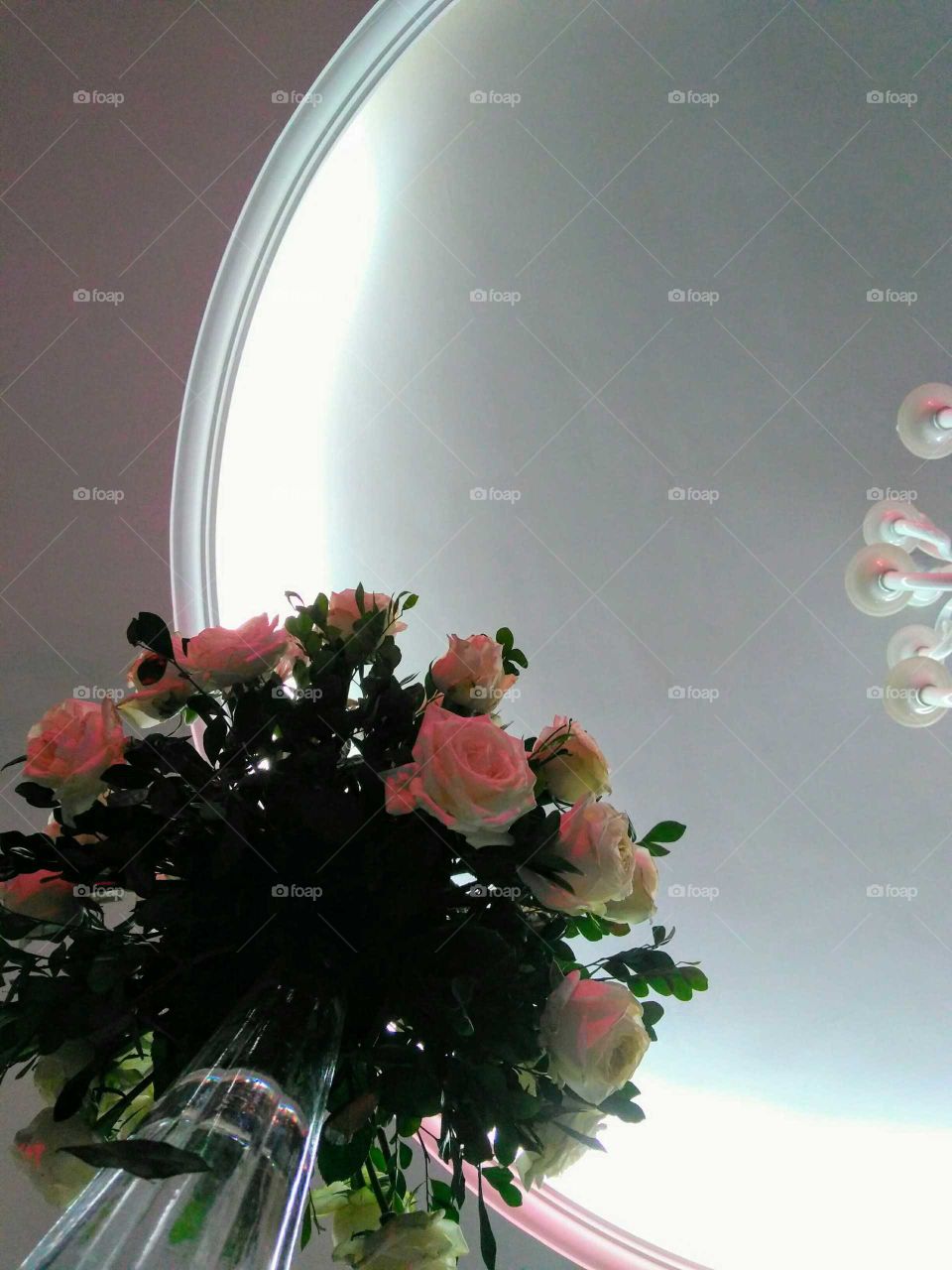 a flower bouquet against the ceiling