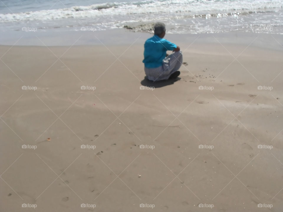 Sitting Alone At the Beach