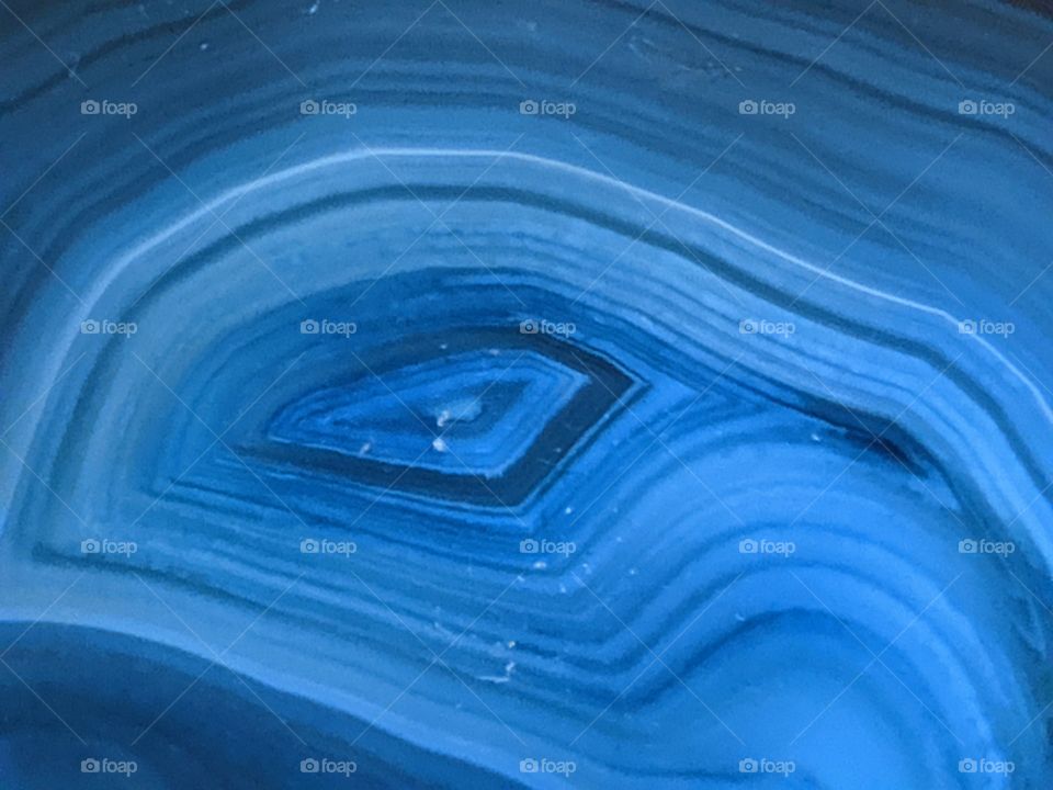 closeup, deep blue, agate coaster, natural geometry, enticing patterns