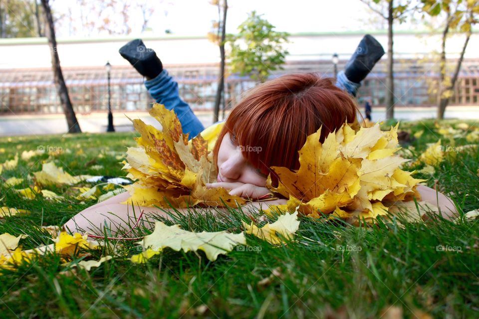Girl lying on grass at park