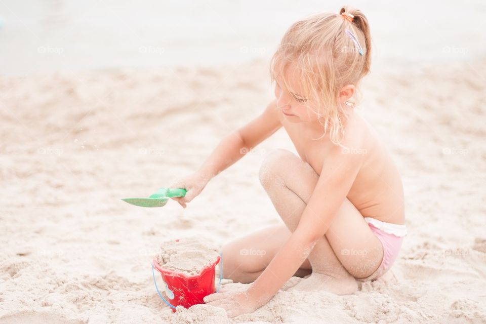 Girl playing on the beach