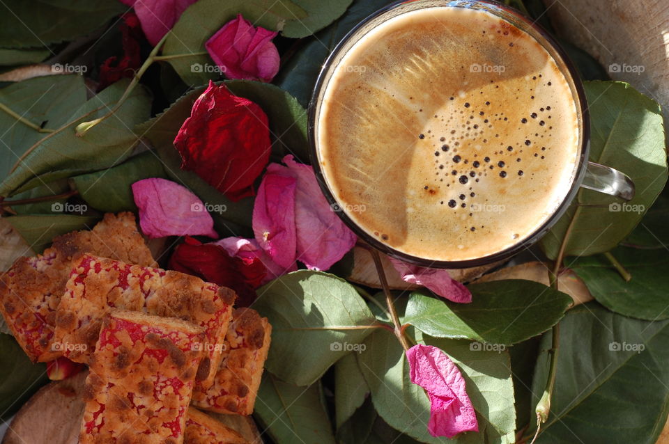 Cup of coffee with cookie