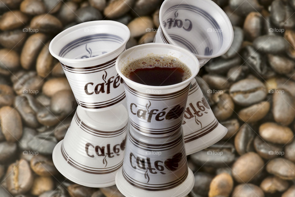 Cups and coffee beans