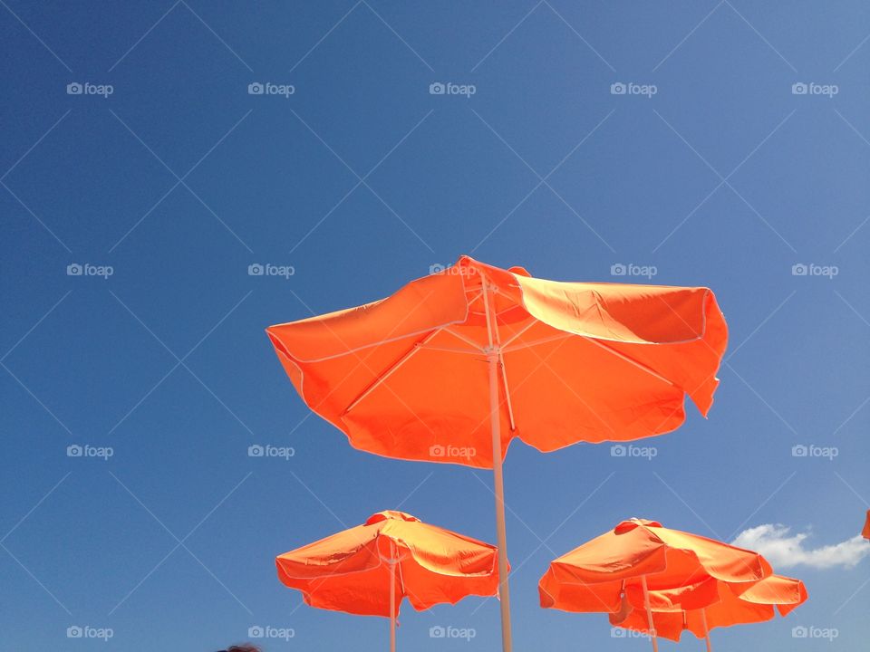 Beach umbrella parasol and blue sky