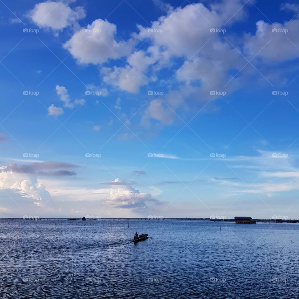 Scenic view of lake against blue sky