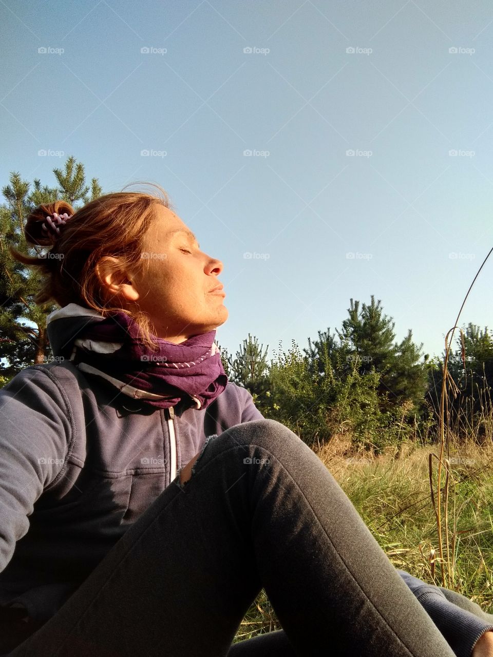 girl resting and sunbathing on a nature  social distance