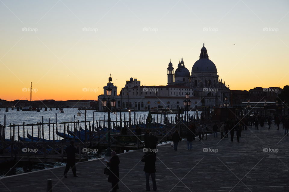 sunset that draws the silhouette of a church