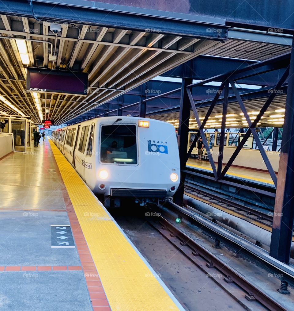 The bart train pulling up to an empty station (during quarantine)