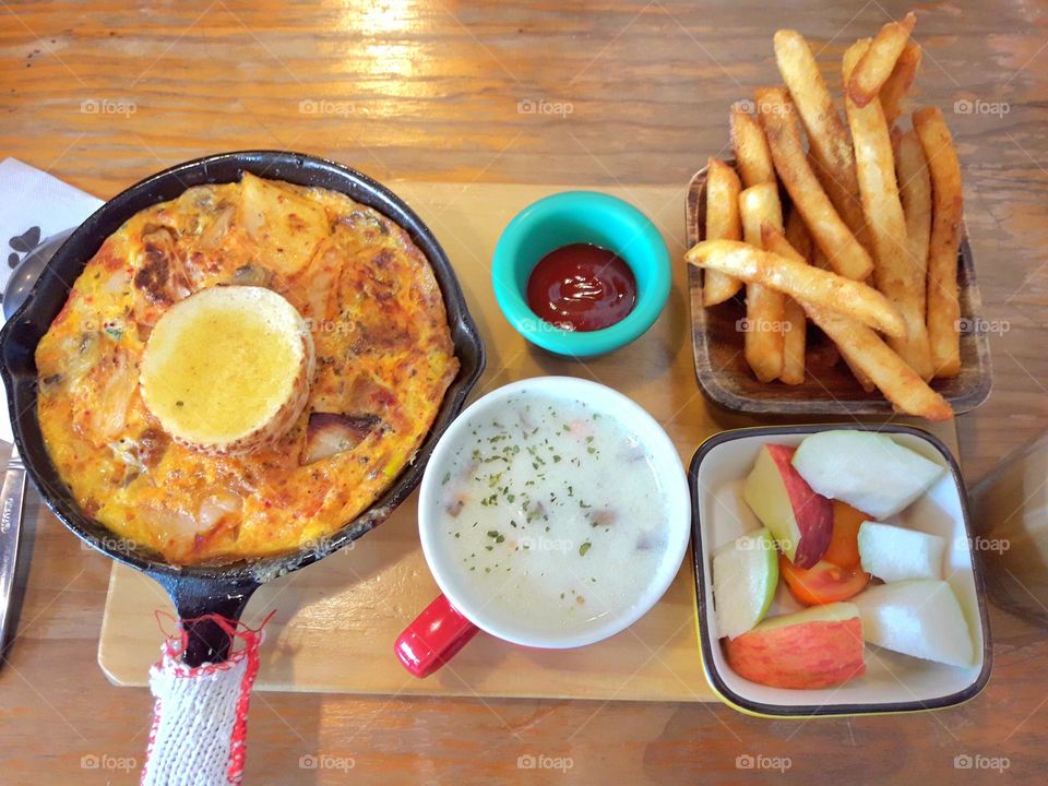 Gratin and Potato with French Fries and Soup with Tomato Sauce and Fruit