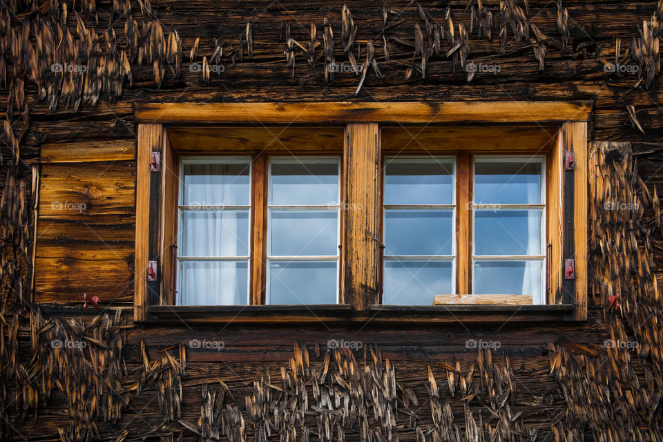 windows of an old farmhouse 