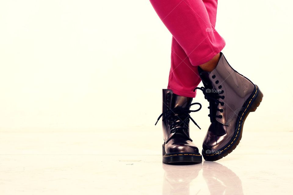 pink pants and shiny leather boots