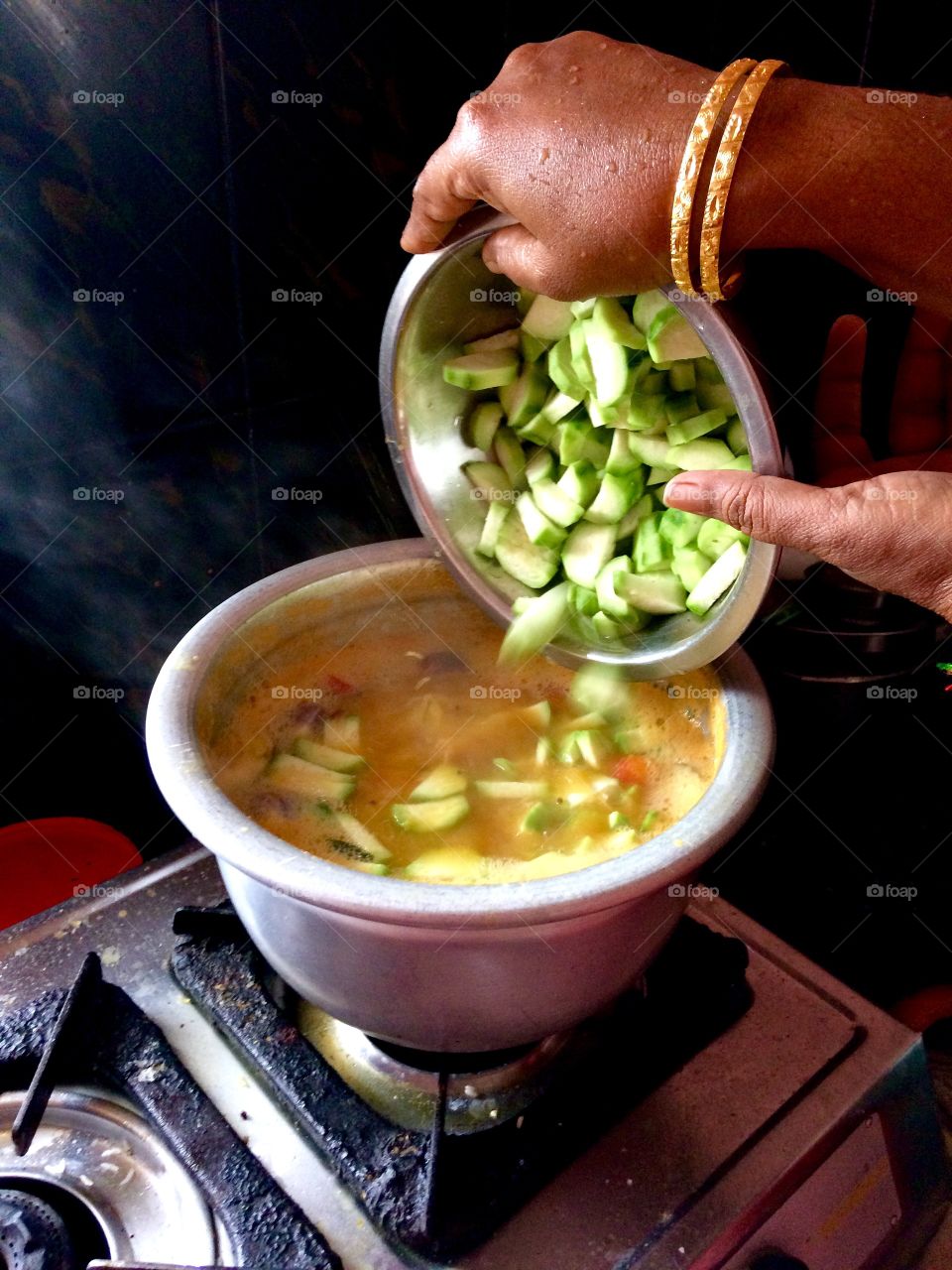 cooking meals sambaar it's Indian food 