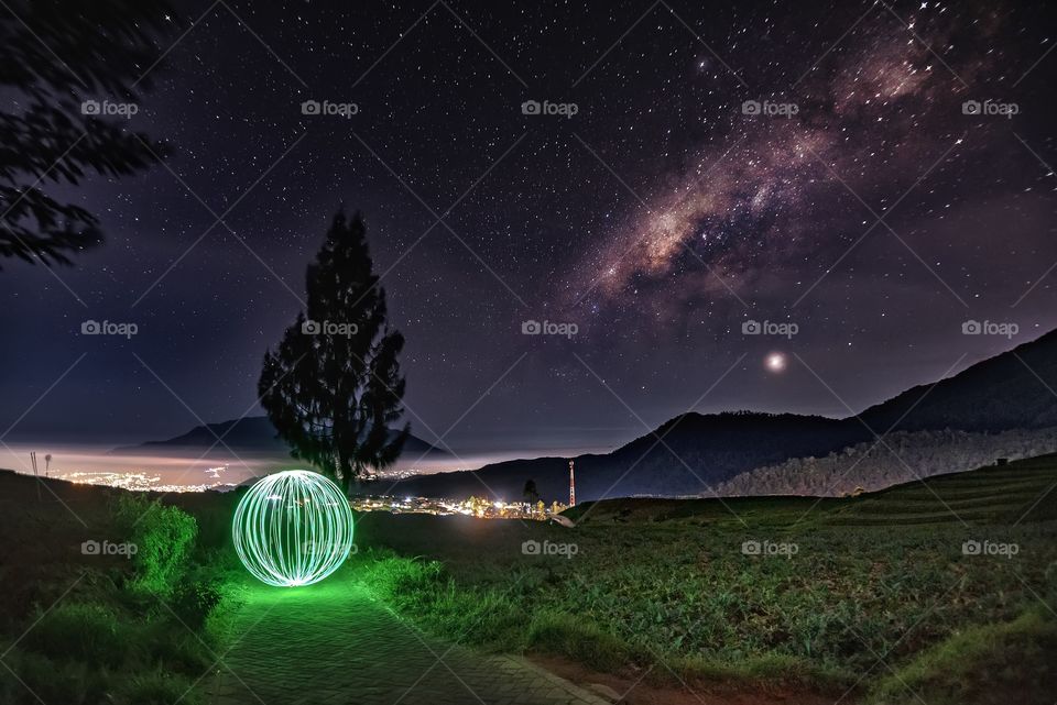 green orb under night sky