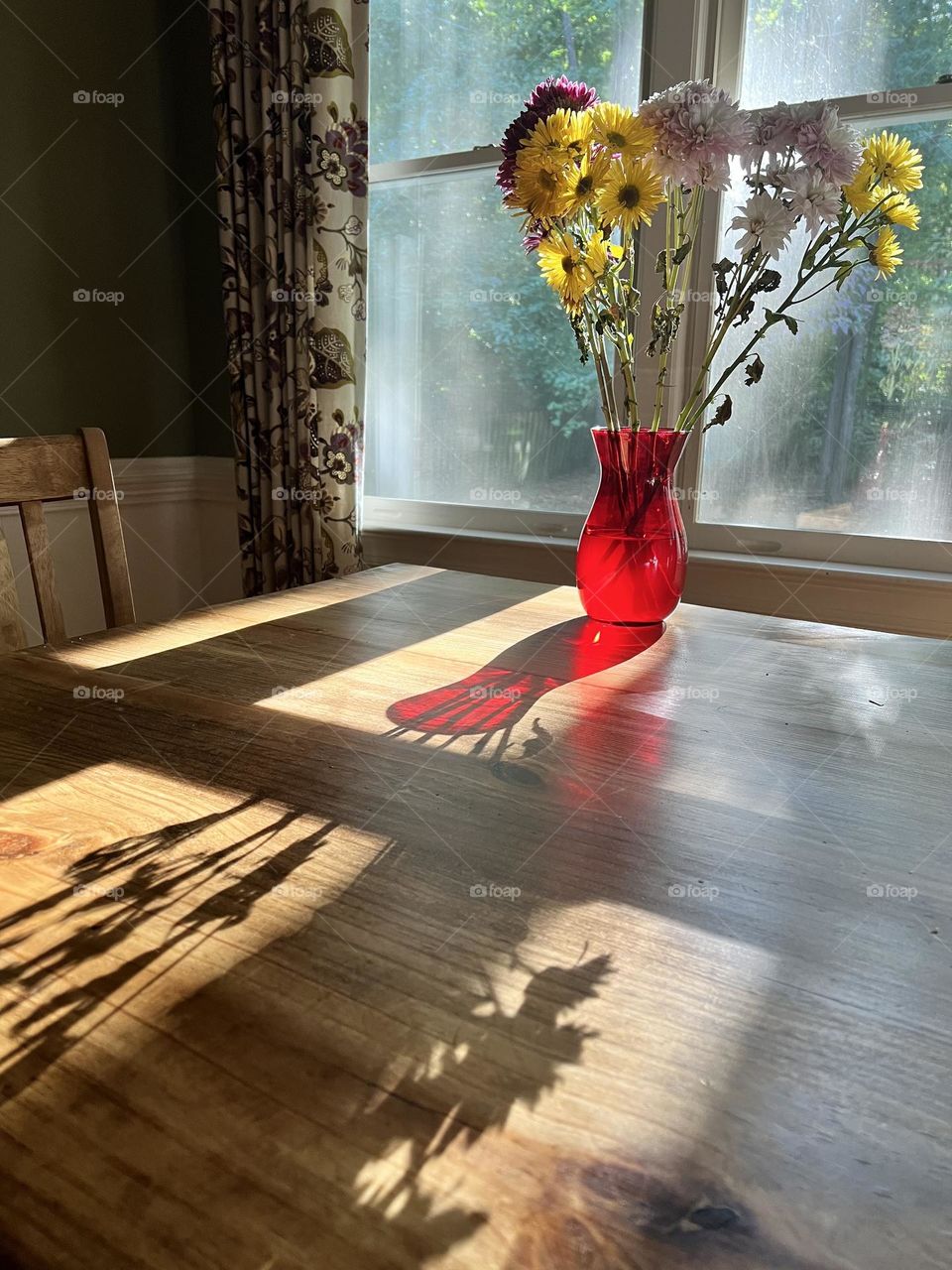 Flowers in a Vase on a Table