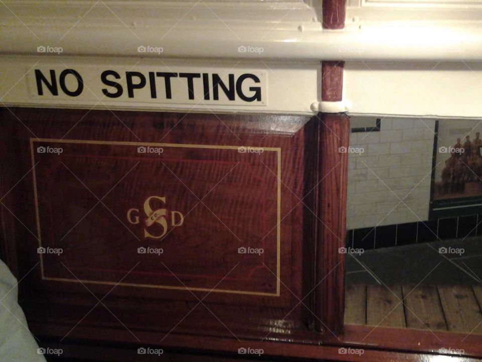 No spitting sign on old steam train 