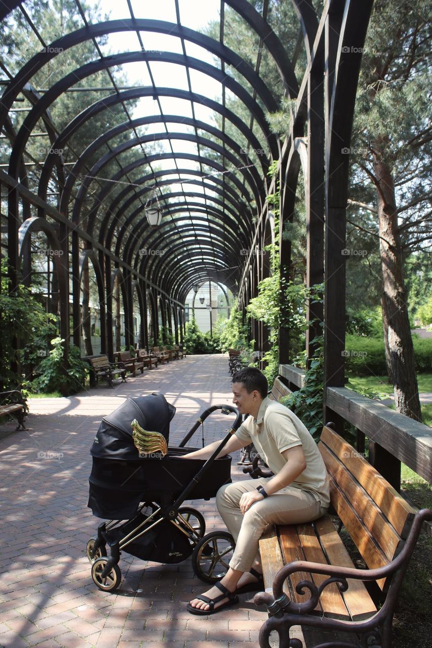 Father and baby in a beautiful park 