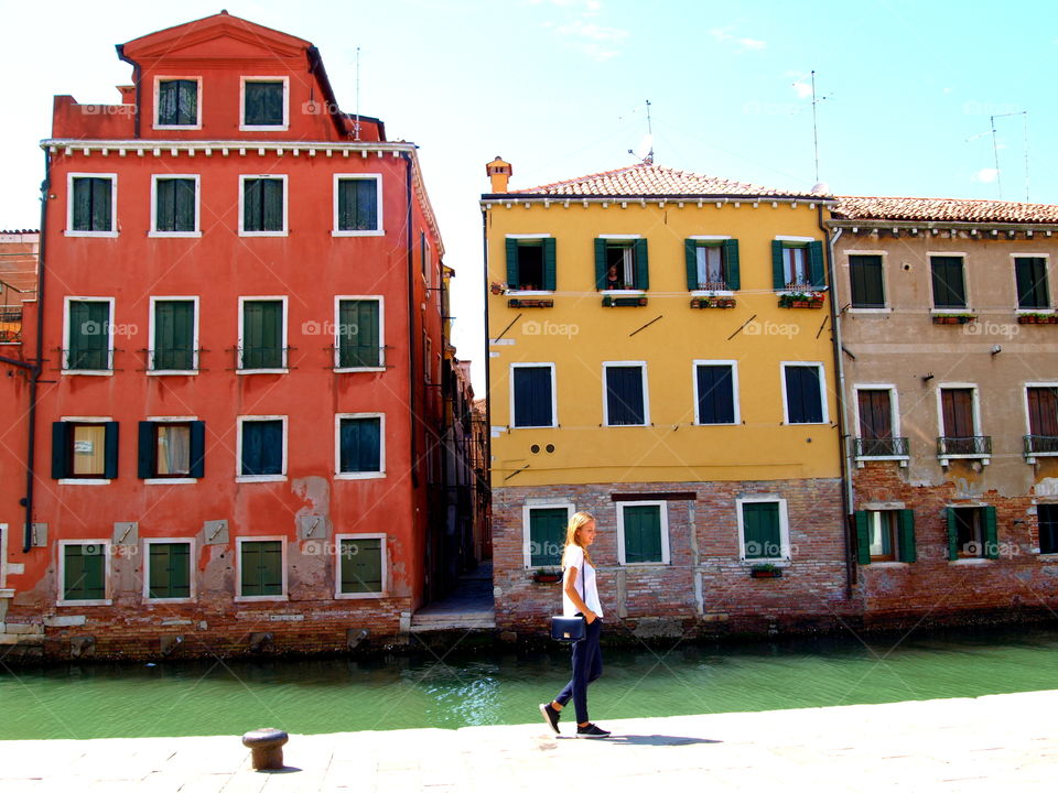 red and yellow houses at a canal, Venice