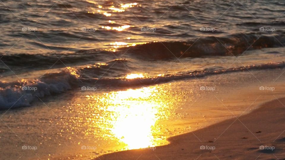 reflections of sun on surf