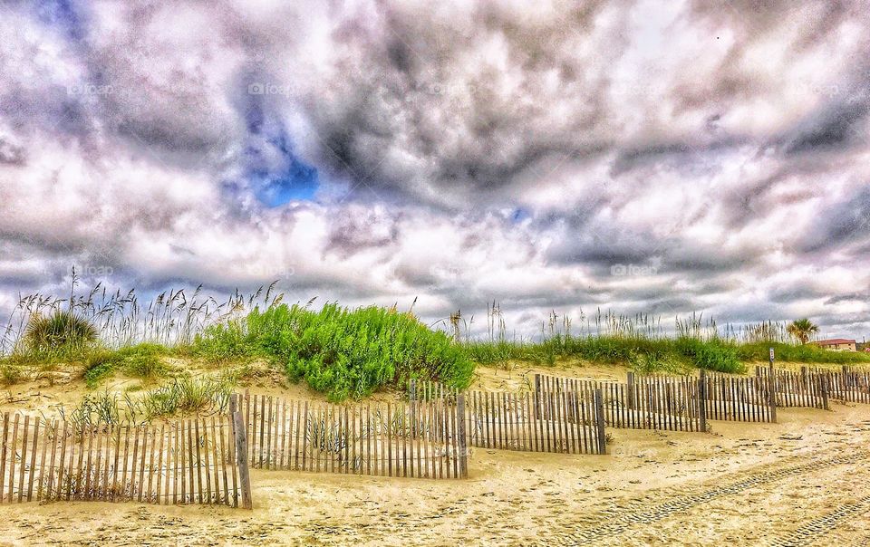 Cloudy skies over dunes