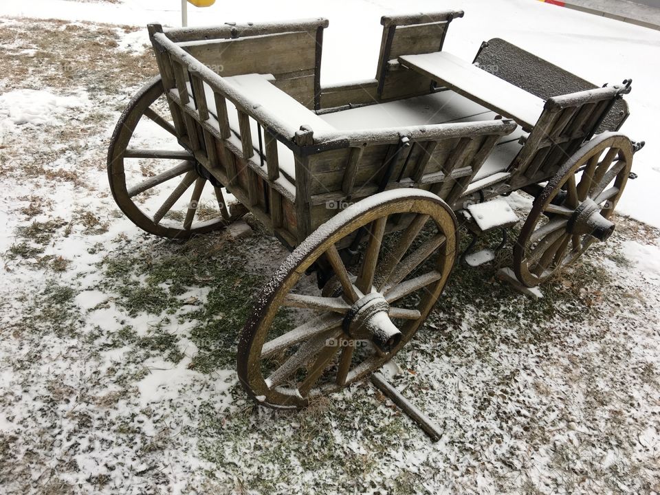Old horse carriage in snow 