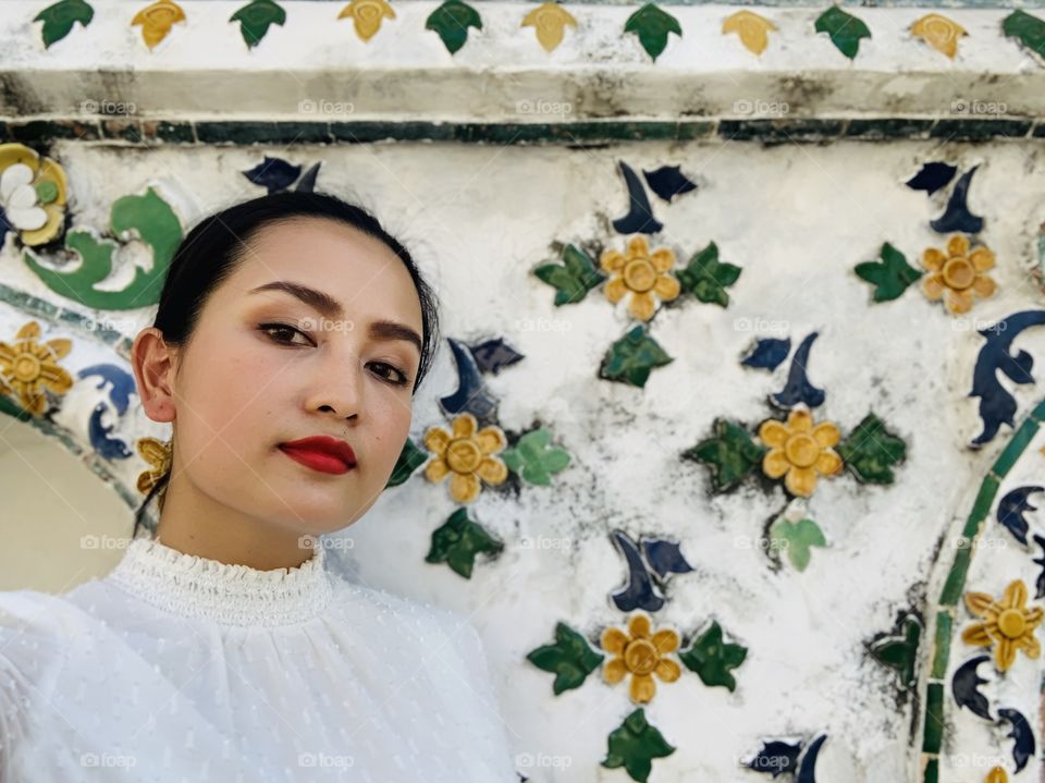 Selfie with red lips and colorful background with light tone today