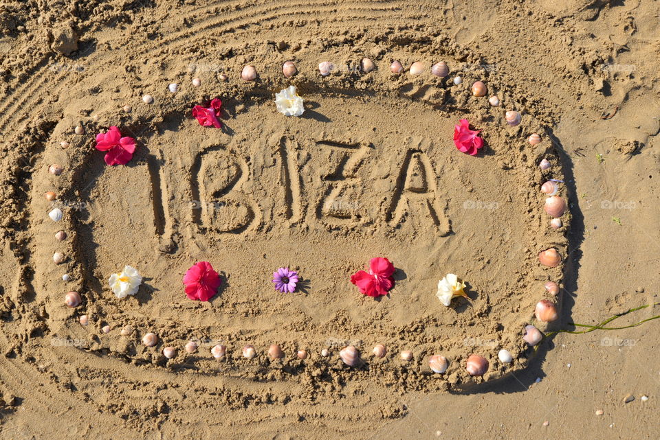 write ibiza on the sand