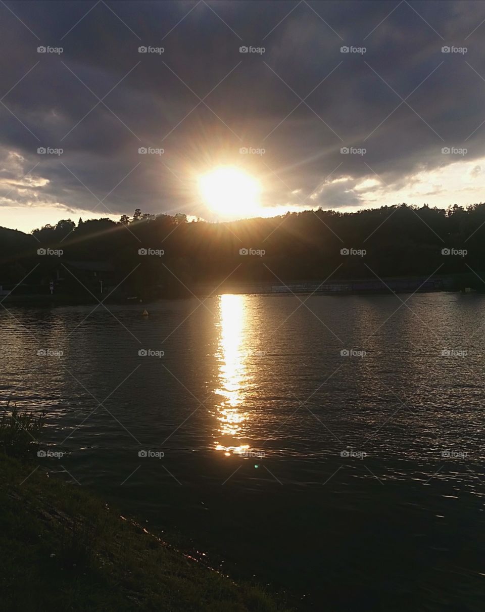 Sun setting at the lake of brno