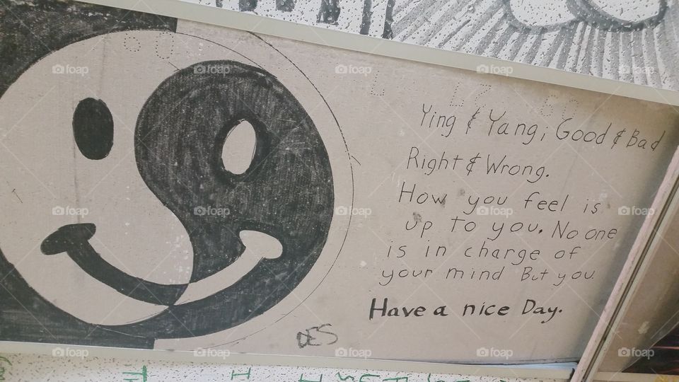 A great description of yin and yang on a ceiling tile.