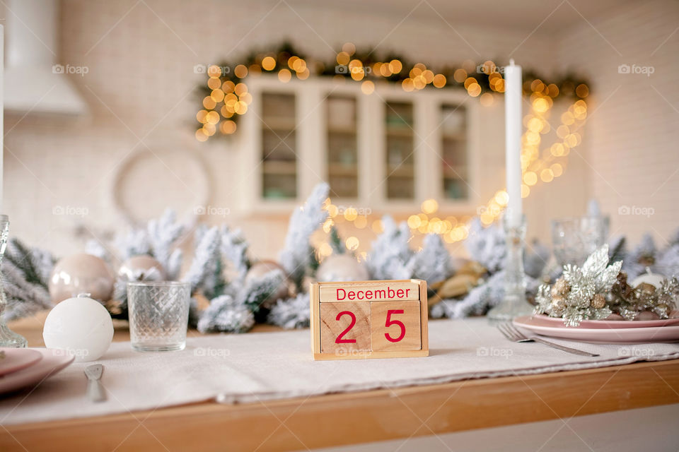 Christmas background with wooden block calendar with the date of December 25