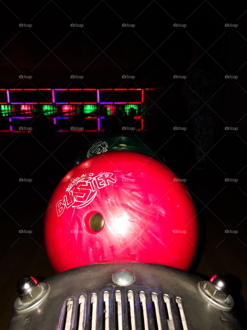 Single bowling ball at bowling alley