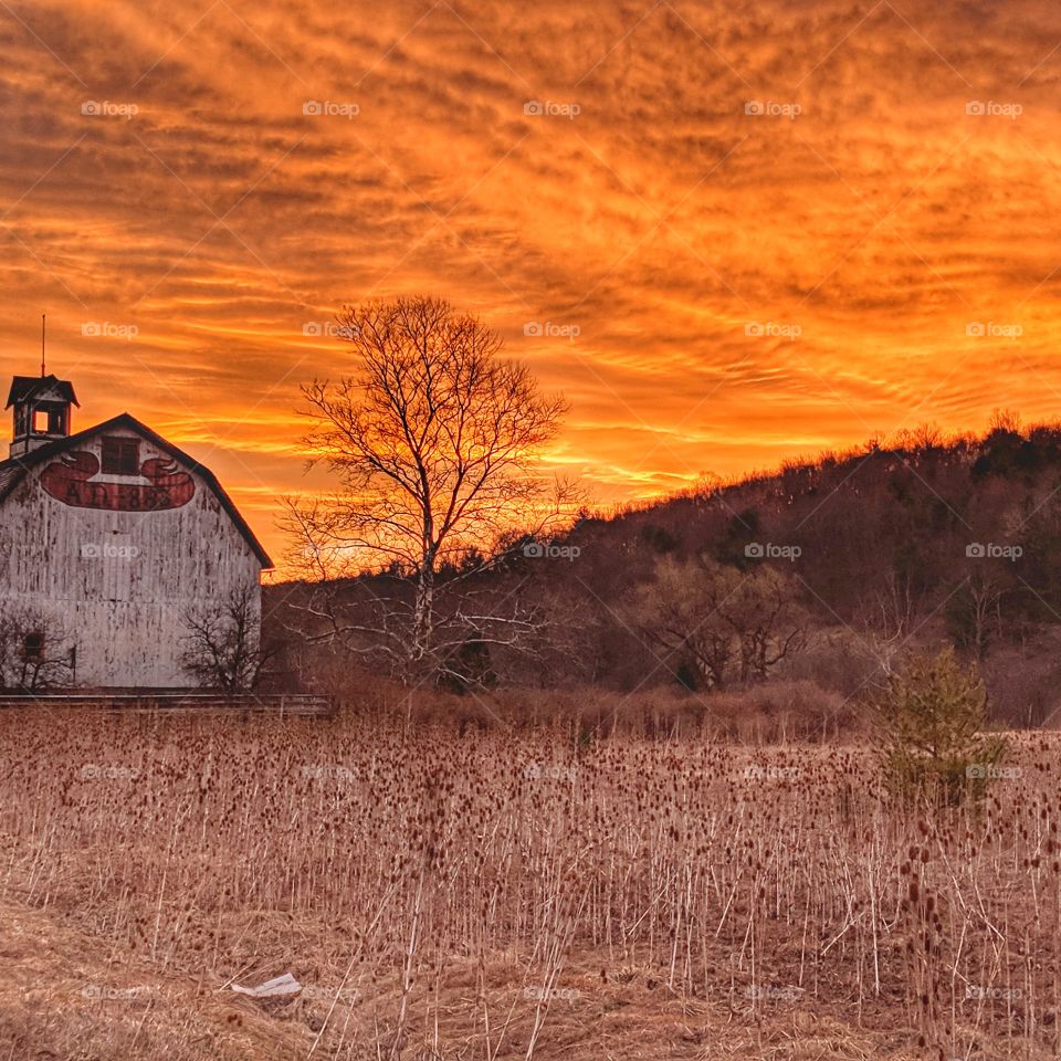 sunrise on abandoned barn
