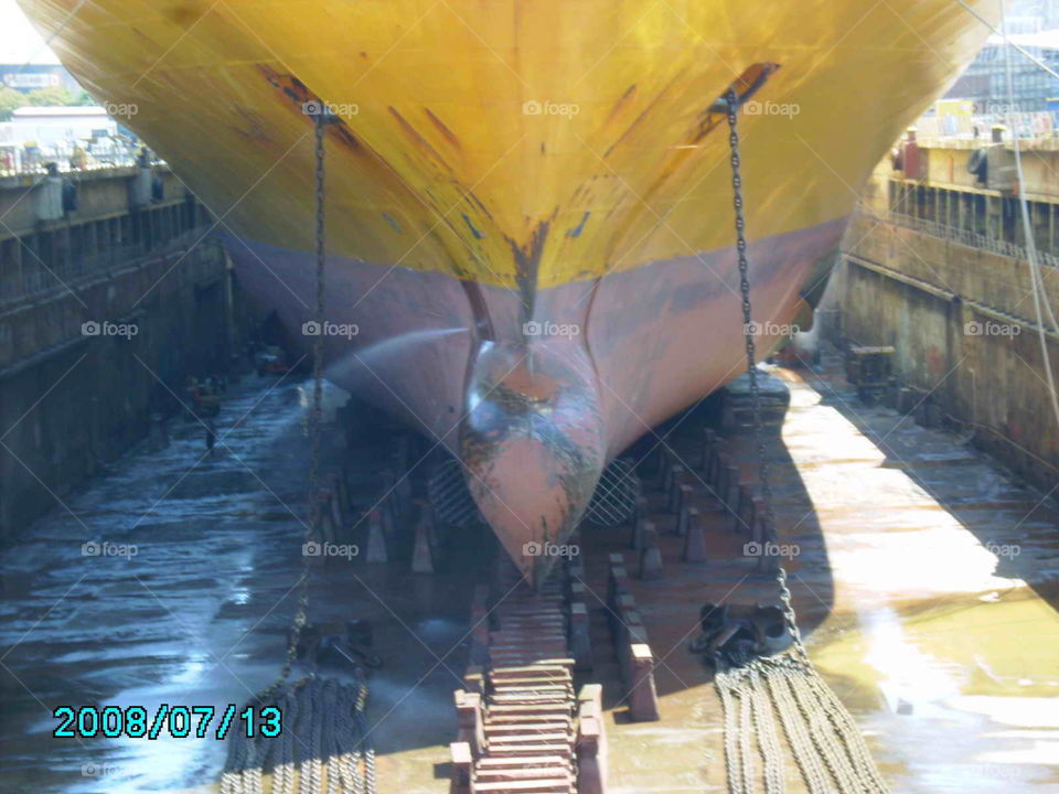 #dry dock#forward view of a ship#anchor chains#dry dock blocks#