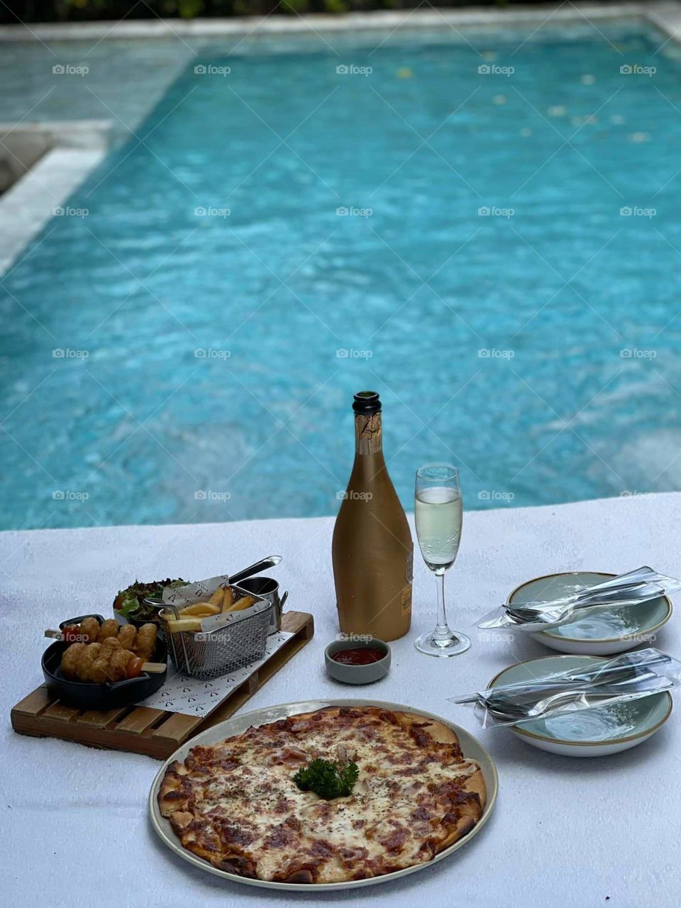 Pizza and Brandy by the pool